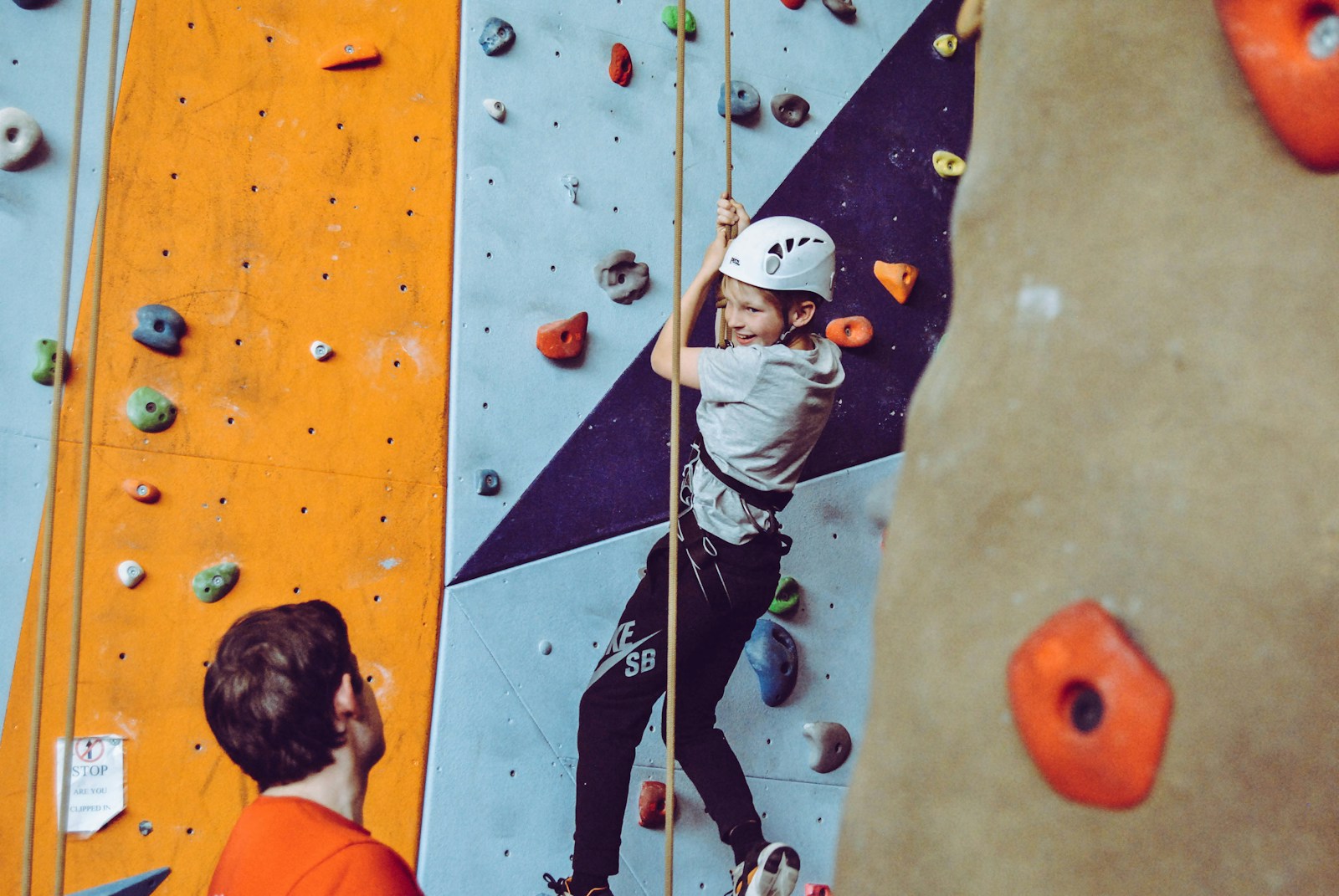 boy doing wall climbing